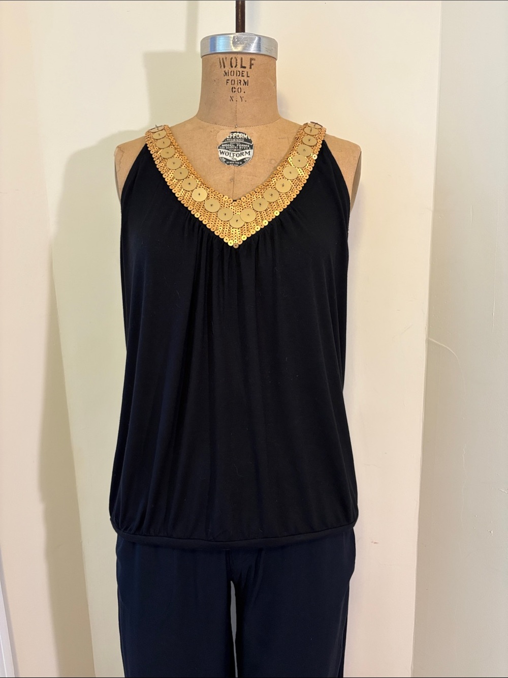 Black Sleeveless V-Neck Top with Gold Trim